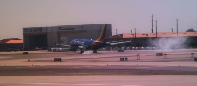 Boeing 737-700 — - scuffing the runway on landing, Rwy 7R