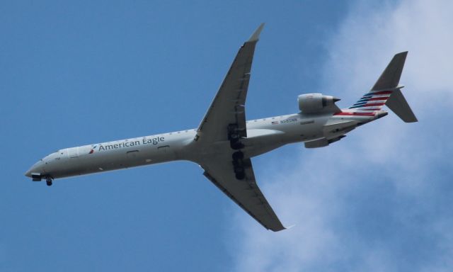 Canadair Regional Jet CRJ-900 (N585NN) - Flying over the Henry Ford Village retirement community in Dearborn, Michigan, approaching KDTW.