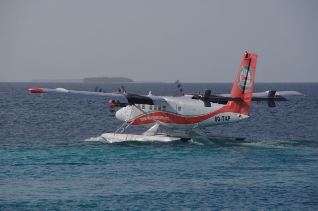 8Q-TAP — - A DHC Twin Otter taking off from a resort in the Maldives