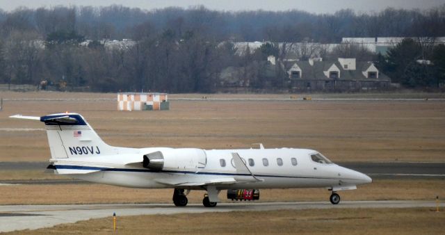Learjet 31 (N90VJ) - Taxiing for departure is this 2002 Learjet 31A in the Winter of 2022.
