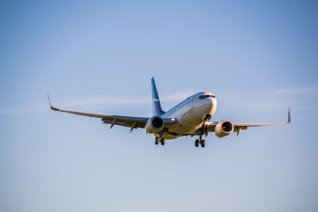 Boeing 737-700 (C-FTWJ) - WJA736 on final at CYXU.