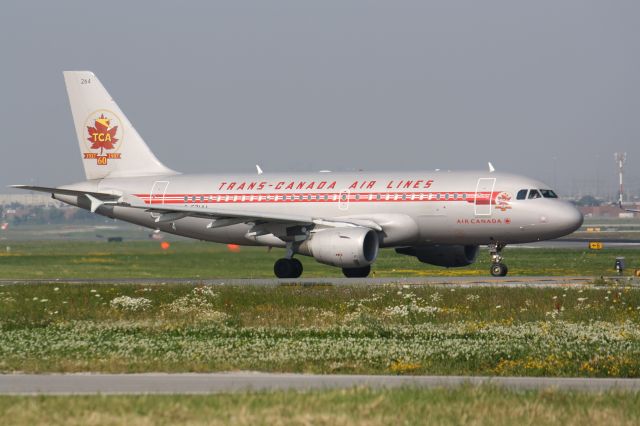 Airbus A319 (C-FZUH) - Trans Canada Air Lines(Air Canada)Departing from Lester B. Pearson Int,l Airport,Very Humid Morning,I wish this plane was done in polished bare metal in this livery,would look sharp...