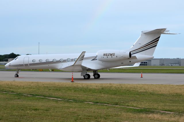 Gulfstream Aerospace Gulfstream V (N62MS) - Just a hint of a rainbow after some storms. June 2012