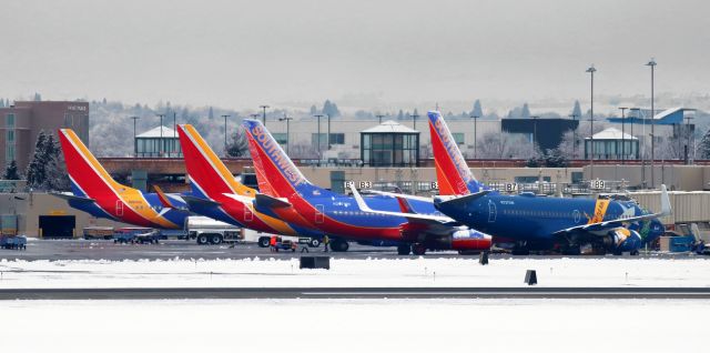 Boeing 737-700 (N727SW) - Southwest's "Nevada One" state liverybird (N727SW) is at the head of a row of four SWA paxbirds at RNO's Concourse B.  Theses were four of the six Southwest jets that RONed at RNO.  