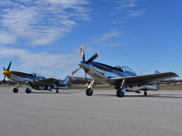 North American P-51 Mustang — - Two P-51s on the ramp