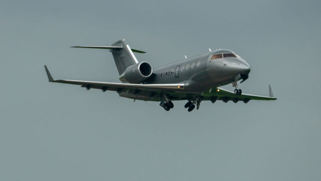 Canadair Challenger (N242CK) - A shiny gray Kalitta Charter Challenger 600 departs EFD on May 24, 2021