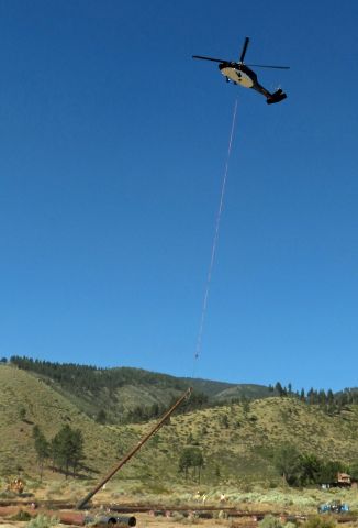 Sikorsky S-70 (N810PJ) - Lifting new steel power pole for NV Energy