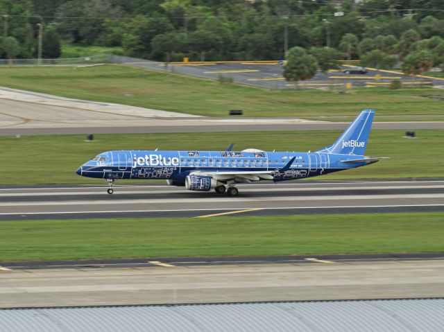 Embraer ERJ-190 (N304JB) - Jet Blues special blueprint livery speeds down the runway on takeoff.