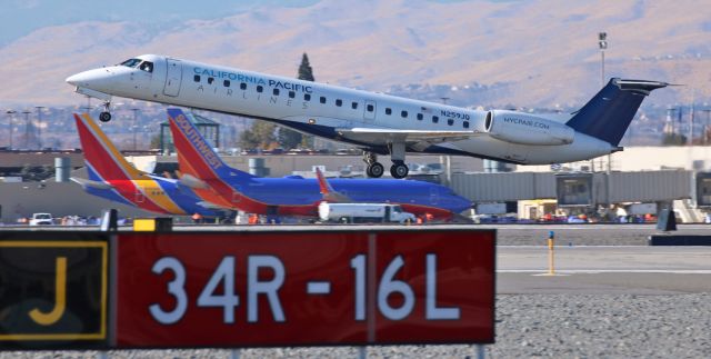 Embraer ERJ-145 (N259JQ) - DYN's N259JQ, now wearing California Pacific Airlines titles, begins its climb away from Reno at the start of a midday RNO-CRQ flight.