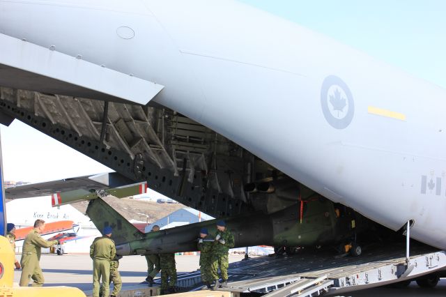 Boeing Globemaster III (17-7702) - Unloading 2 C-146 Griffon