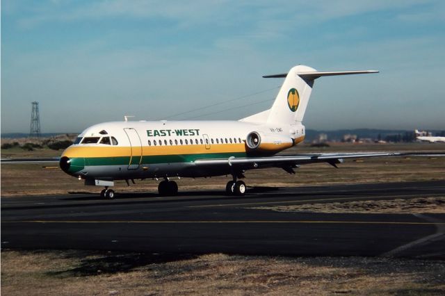 — — -  EAST WEST AIRLINES - FOKKER F-28-3000 FELLOWSHIP - REG : VH-EWF (CN 11143) - KINGSFORD SMITH SYDNEY NSW. AUSTRALIA - YSSY 27/6/1988 35MM SLIDE SCANNED WITH A EPSON PERFECTION V700 FLATBED SCANNER