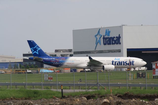 Airbus A330-300 (C-GTSO) - On tarmac next to Air Transat hangar