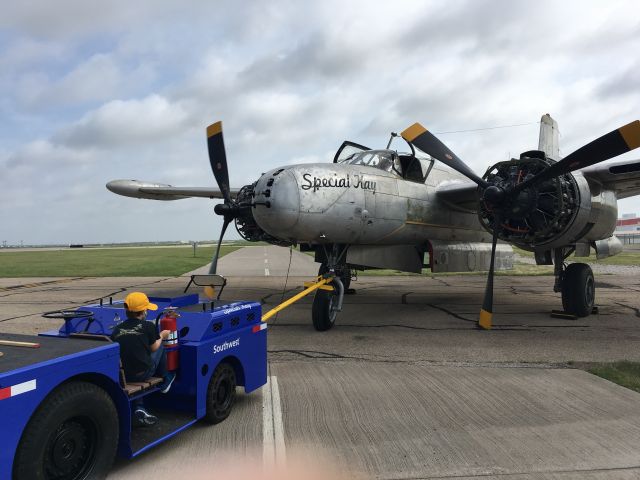 N4988N — - Getting Kay in position for final run on Sunday, July 2nd, 2017. Our ramp is in bad shape so we have to block the access road just to find a space clean enough to run.  Then the areas around the props are blown with a weed blower.  Small rocks and pieces of gravel are hard on these props with low ground clearance.  Standing by on the tug is Tristan, third wiper.