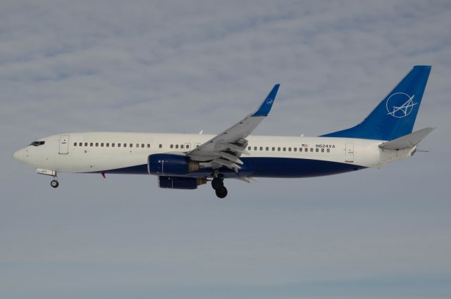 Boeing 737-800 (N624XA) - IAero Airways 6854 is coming into land at DSM's Runway 31 arriving from Bullhead City, AZ. This aircraft is a former Xtra Airways 738 and you can even see some portions of the old livery still visible on this aircraft. Photo taken at 1:25 PM on January 5, 2021 with Nikon D3200 at 92 mm.