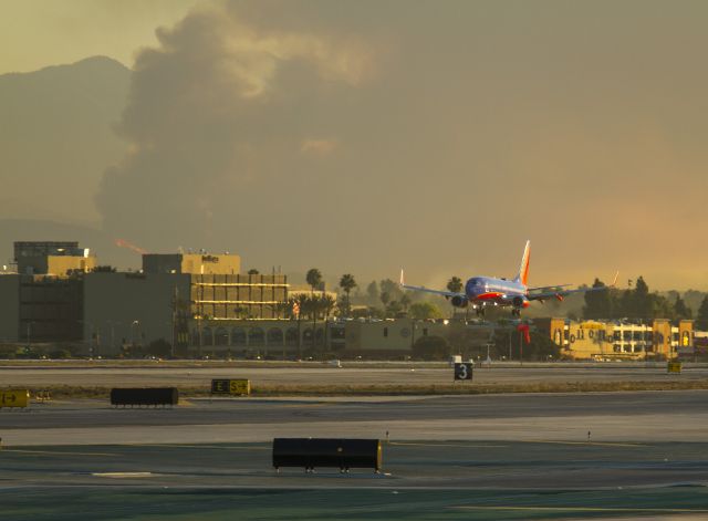 Boeing 737-700 — - View looking northeast towards downtown Los Angeles, California USA. A fast moving forest fire started about 6:00 am near Glendora, California near the Los Angeles National Forest. It was visible from LAX and filled the eastern sky with smoke. See news footage here.  a rel=nofollow href=http://www.latimes.com/local/lanow/la-me-ln-colby-fire-glendora-20140116,0,1487828.story#axzz2qad0eAPWhttp://www.latimes.com/local/lanow/la-me-ln-colby-fire-glendora-20140116,0,1487828.story#axzz2qad0eAPW/a