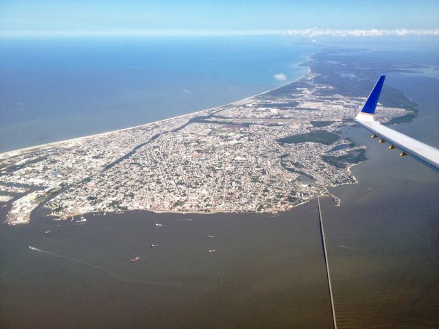 — — - After take off, a nice view from 3C of the island of Ciudad del Carmen, Campeche for a 2.5 hrs ride to Houston, TX