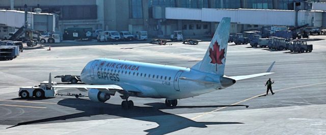 Embraer 170/175 (C-FEJB) - Air Canada Express Embraer 170 leaving  KBOS gate for Toronto Pearson - (CYYZ)