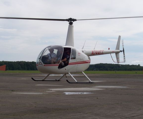 Robinson R-44 (N244CC) - Departing THA after a quick refuel enroute to the Bonnaroo Music Festival in Manchester TN.  Helicopter was working as a VIP transport for festival organizers.