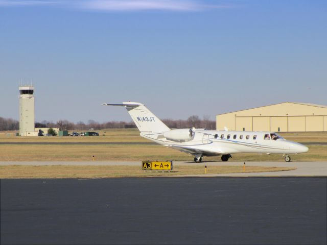 Cessna Citation CJ3 (N143JT) - Taxiing to the terminal is this 2007 Cessna Citation 525B in the Winter of 2014.