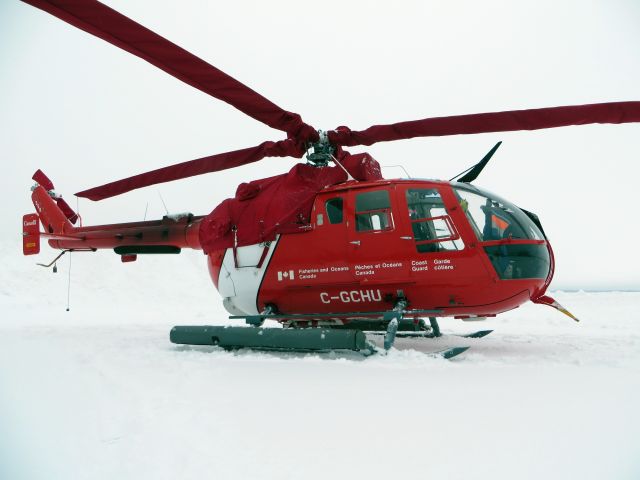 PADC BO-105 (C-GCHU) - C-GCHU, a Canadian Coast Guard Messerschmitt-Bölkow-Blohm Bo 105 sitting in the snow with  engine and blade covers. Sept-Iles, Quebec - January 2014