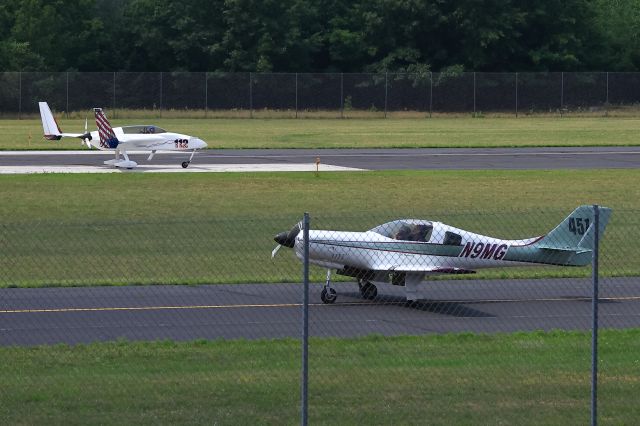 N12LZ — - Afternoon taxi at KAUW on 23 July 2023 passing N9MG.