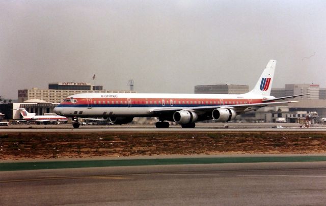 McDonnell Douglas DC-8-70 — - KLAX - Nov 1998 arriving from ORD this long haul DC 8 braking down on 25 L on a typical murky smog infested day at LAX.