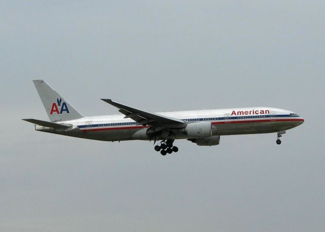 Boeing 777-200 (N751AN) - Landing on 18R at DFW. Hard to tell but its pouring down rain! Not a good day to photograph airplanes!