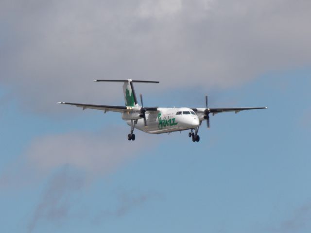 de Havilland Dash 8-100 (C-FGRP) - In the parking lot of the 100th Bomber Group across the street fro CLE.