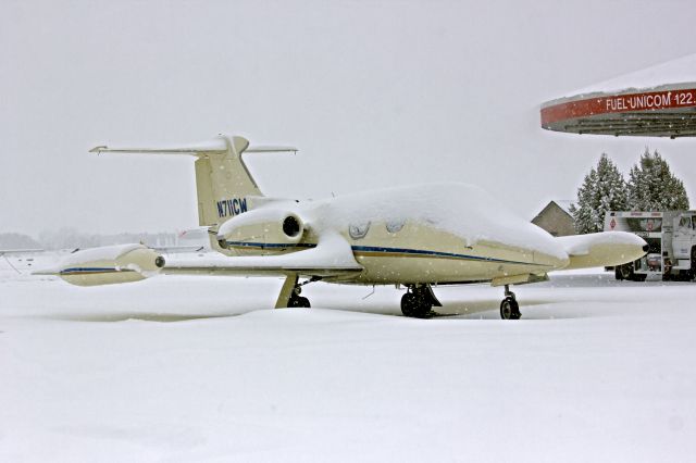 Learjet 24 (N711CW) - Rare, snowy day at Hillsboro. 2-08-14