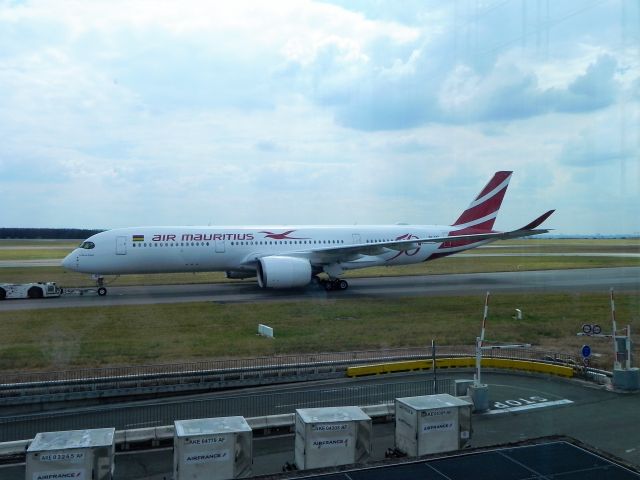 Airbus A350-900 (3B-NBP) - Airbus A350-941 in special 50th Anniversary colors being towed to the stand to operate Air Mauritius 45 to Port Louis, Mauritius