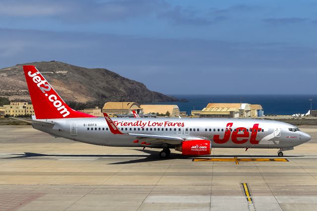 Boeing 737-800 (G-GDFS) - taken through a closed terminal window!