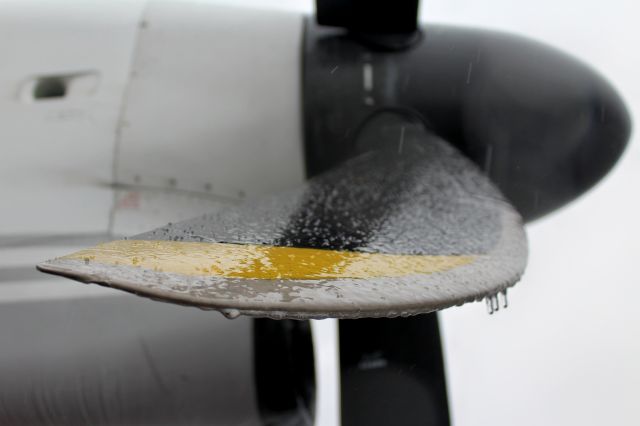 — — - Freezing rain.Iced up prop blade 