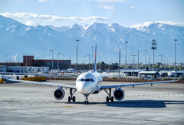 Airbus A319 (N370NB) - 5/7/2021.  Taxiing out just after pushback with the beautiful mountains in the background.