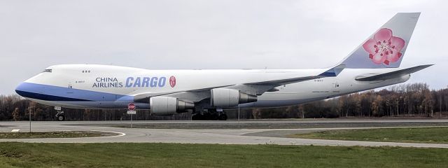 Boeing 747-400 (B-18717) - Taxiing at Anchorage International Airport, viewed from airport maintenance station.