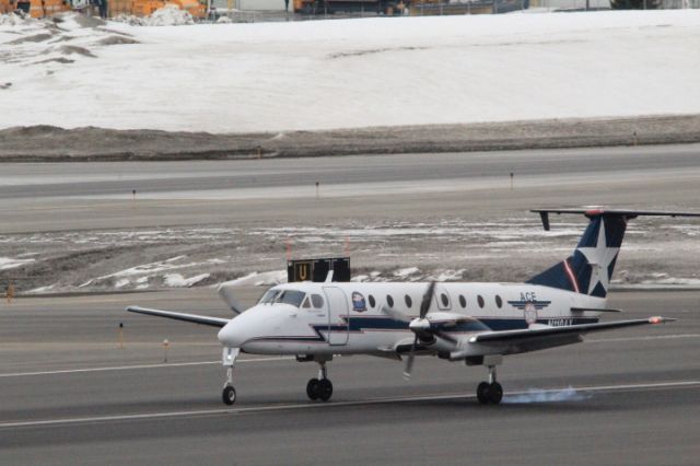 Beechcraft 1900 (N110AX) - Touchdown Runway 33