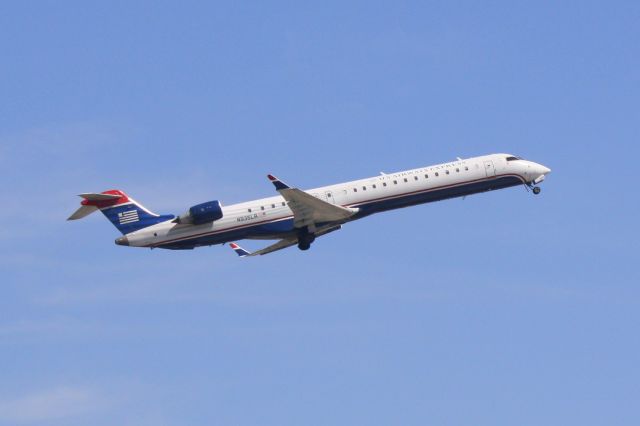 Canadair Regional Jet CRJ-900 (N935LR) - Mesa/US Air Flight 2647 (N935LR) departs Runway 14 at Sarasota-Bradenton International Airport enroute to Charlotte/Douglas International Airport