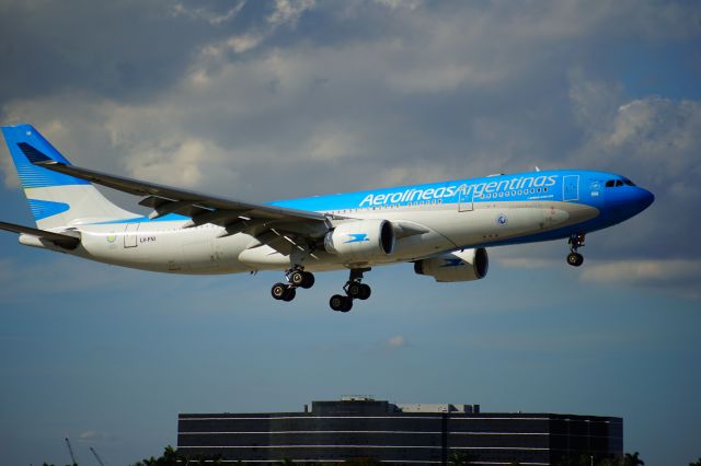 LV-FNI — - A330 gliding in.  Best photo spot in Miami, for MIA, is near the El Dorado Furniture Outlet Store.  That is at the intersection of NW 72 Avenue and NW 12 Street.  You are below fence level, however, it is so close to the end of the Runway 9R, that most planes are above the fence level like this one, as they pass very closely by you.  