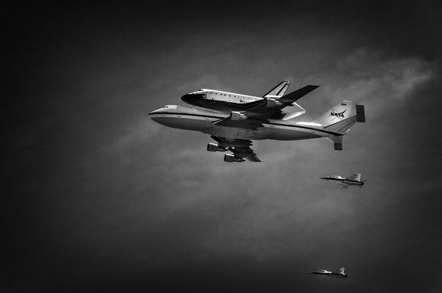 — — - Shuttle Endeavor doing fly over of downtown Los Angeles on last flight.