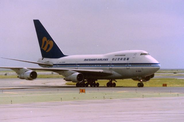 BOEING 747SP (B-1880) - KSFO - Mandarin Airlines 747SP rolling off 28L after arriving at San Francisco on the daily flight from Hong Kong. Photo taken from inside the American Airlines terminal.CN: 22298 LN:445. This may have been the 31st 747SP built out of 45 by Boeing.