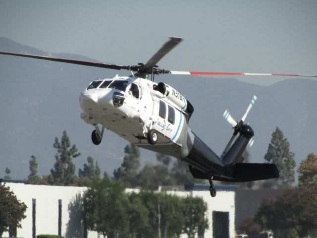 Sikorsky S-70 (N51BH) - Lifting off from KPOC