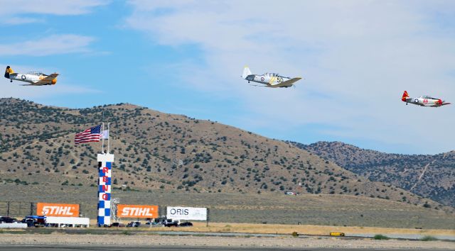 North American T-6 Texan — - Lee Oman's AT-6 "Eros" (Race 69) leads the way past the Start - Finish Pylon in this photo taken at the 2018 NCAR event.