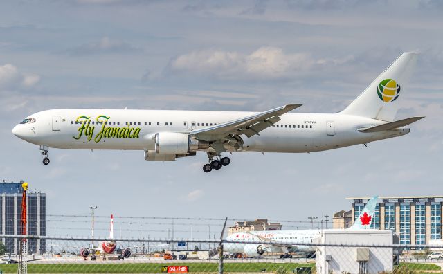 BOEING 767-300 (N767WA) - …now with tail logo : ) about to touch down on runway 24R at YYZ