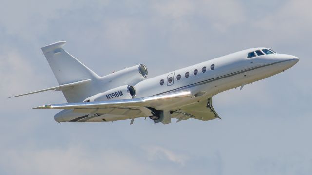 Dassault Falcon 50 (N198M) - June 10, 2017, Nashville, Tennessee -- One of Taylor Swift's fleet of Falcon Jets is departing off runway 20R. The photo was made at the Vultee OBS Lot. UPDATE: Registration has changed & N-Number change is pending: N803NL