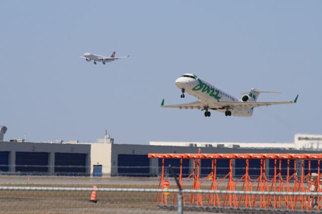 Canadair Regional Jet CRJ-200 (C-FXMY) - Swiss flight arriving and Jazz flight departing at Montreal-Trudeau