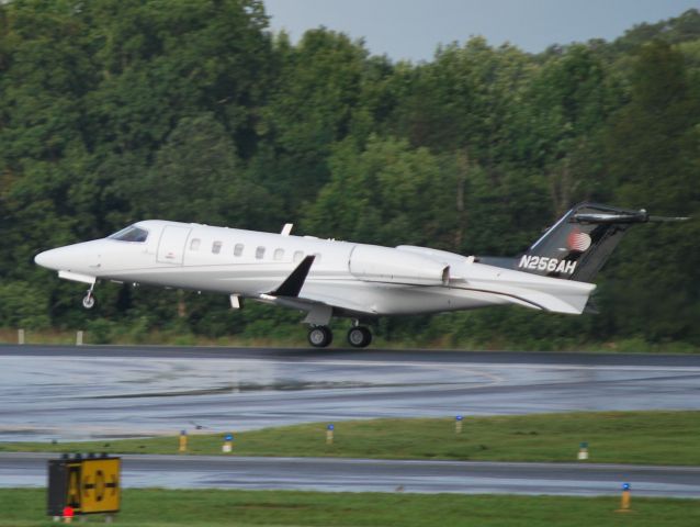 Learjet 40 (N256AH) - APPLE SIX HOSPITALITY AIR LLC departing runway 2 after heavy storms - 8/15/12