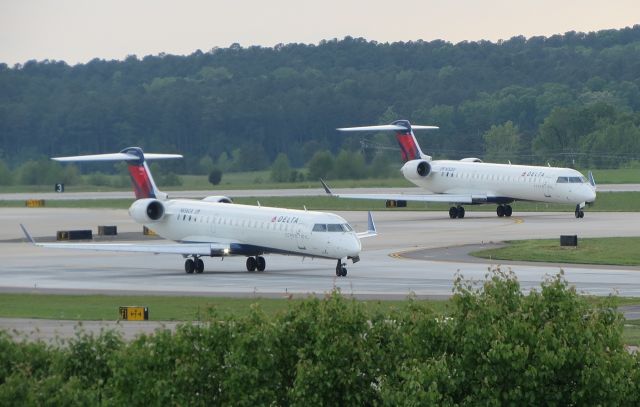 Canadair Regional Jet CRJ-700 (N656CA) - Drag race to see who departs first.. N752EV in the background