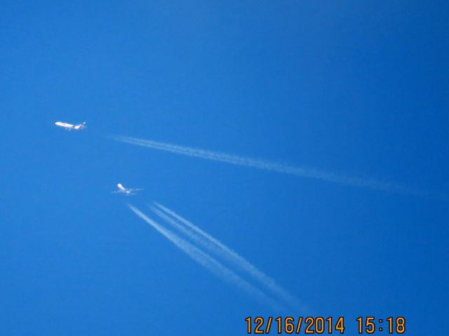 Boeing 747-200 (N477MC) - Atlas Air flight 2862 from SDF to PHX over Southeastern Kansas at 37,000 feet with a FedEx MD-11 passing in front.