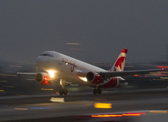 Airbus A319 (C-FYKW) - Pre-dawn take off from LAX. 