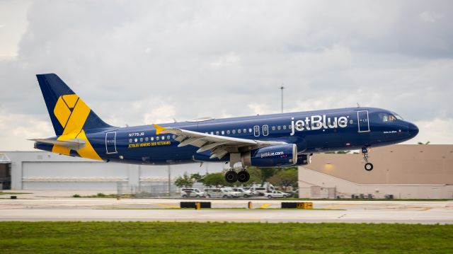 Airbus A320 (N775JB) - Jetblue A320 "Jetblue Honors our Veteran" livery landing on runway 10R