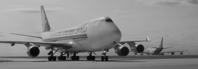 Boeing 747-400 (9V-SFN) - Formula 1 - Outbound Cargo Operation. Six B747-400Fs loaded and sent to Brazil 11/19/2012.